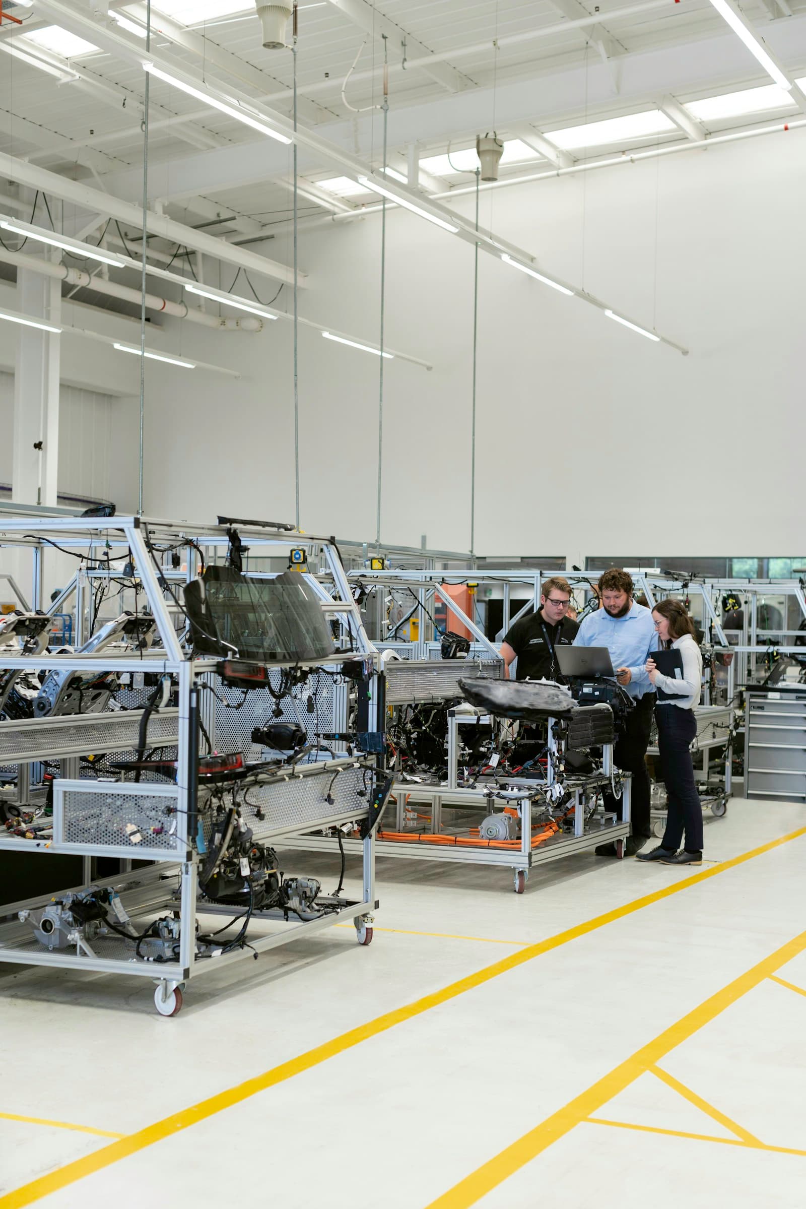 Specialists collaborating on the production floor